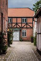 Street with old houses from royal town Ribe in Denmark photo