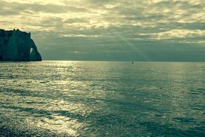 White cliffs on the coast of France near the town of Etretat in Normandy photo