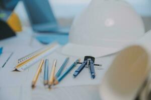 Construction and structure concept of Engineer or architect meeting for project working with partner and engineering tools on model building and blueprint in working site, contract for both companies. photo