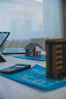 Construction and structure concept of Engineer or architect meeting for project working with partner and engineering tools on model building and blueprint in working site, contract for both companies. photo