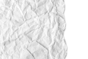 Recycled crumpled white paper texture with a torn edge isolated on white background photo