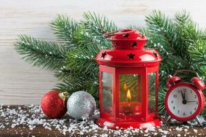 Burning candle lantern with decorations. photo