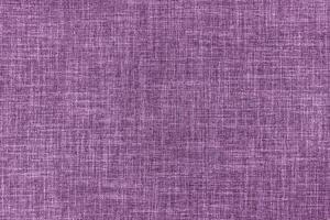 Texture of purple upholstery fabric. Decorative textile background photo