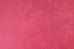 Pink velours upholstery fabric texture background. photo