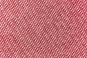 Natural red linen texture with striped diagonal pattern as background, wallpaper photo