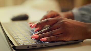 Teleworker typing new story ideas for blog, self employed person working at home office. African american woman develops on freelancing and blogging career. Handheld shot. Close up. photo