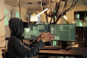 Online specialist working with interaactive vr headset to crack server encryption, trying to steal information and passwords. Female spy planting malware on virtual reality 3d glasses. photo