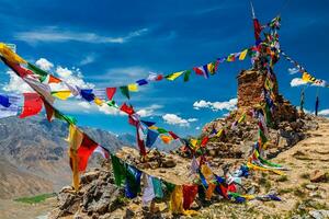 Buddhist prayer flags in Himalayas photo