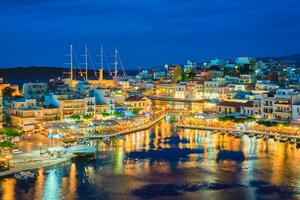 Beautiful Agios Nikolaos town at night. Lasithi region of Crete island, Greece photo