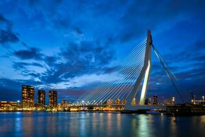 View of Erasmus Bridge Erasmusbrug and Rotterdam skyline. Rotterdam, Netherlands photo