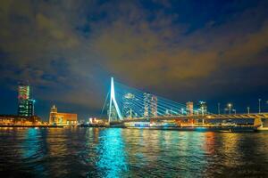 View of Erasmus Bridge Erasmusbrug and Rotterdam skyline. Rotterdam, Netherlands photo