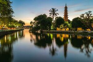 Tran Quoc Pagoda, aka Khai Quoc , the oldest Buddhist temple in Hanoi, Vietnam photo