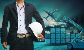 engineer man standing with white safety helmet against beautiful dusky sky with building construction site use for engineering and construction industrial business photo