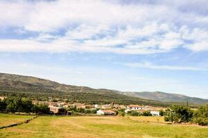 a view of a village in the mountains photo