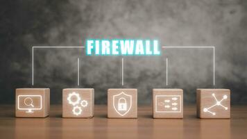 Firewall concept, Wooden block on desk with firewall icon on virtual screen. photo