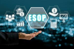 ESOP, Employee Stock Ownership Plan concept, Business person hand holding Employee Stock Ownership Plan icon on virtual screen. photo