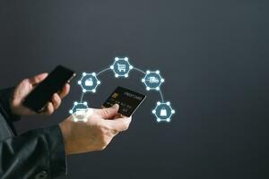 businessman showing a mock-up credit card for business and shopping to make payment and smartphone.half body. purchase, commerce, financial, card, money, using technology. selective focus. photo