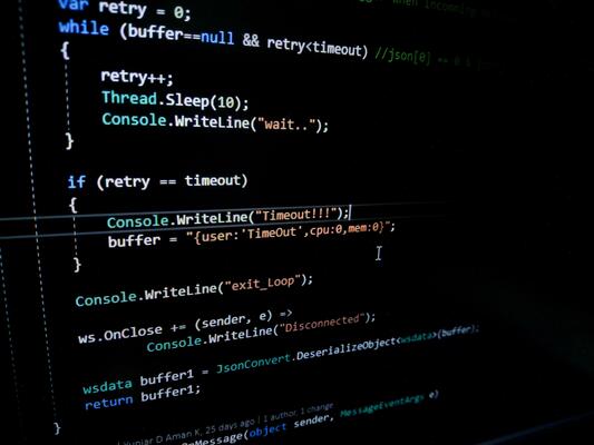 Programming code on a computer screen. Source code photo. Technology background.