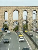 15 of April 2023 - Istanbul, Turkey - The Valens Aqueduct is part of the water supply system of Constantinople. Located in the old part of Istanbul on Ataturk Boulevard. photo