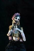 Catrina or skull with elegant clothing of flowers, earrings and jewelry on the day of the dead photo