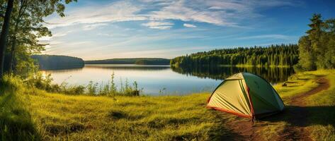 AI generated Camping tent on the shore of a lake at sunset. photo