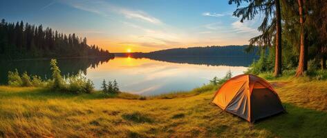 AI generated Camping tent on the shore of a lake at sunset. photo