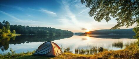 ai generado cámping tienda en el apuntalar de un lago a puesta de sol. foto