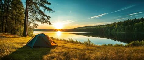 ai generado cámping tienda en el apuntalar de un lago a puesta de sol. foto