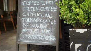 Cafe menu on black board outdoor video