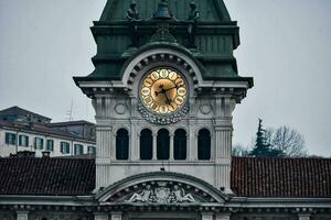 a clock tower with a large clock on top photo