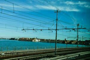 a view of the water and train tracks photo