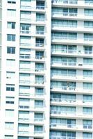 a tall building with many windows and balconies photo