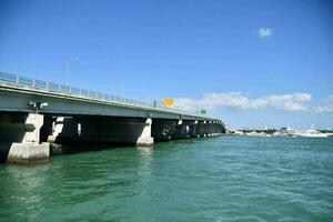 a bridge spanning over the water photo