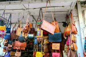a shop with many bags hanging on the wall photo