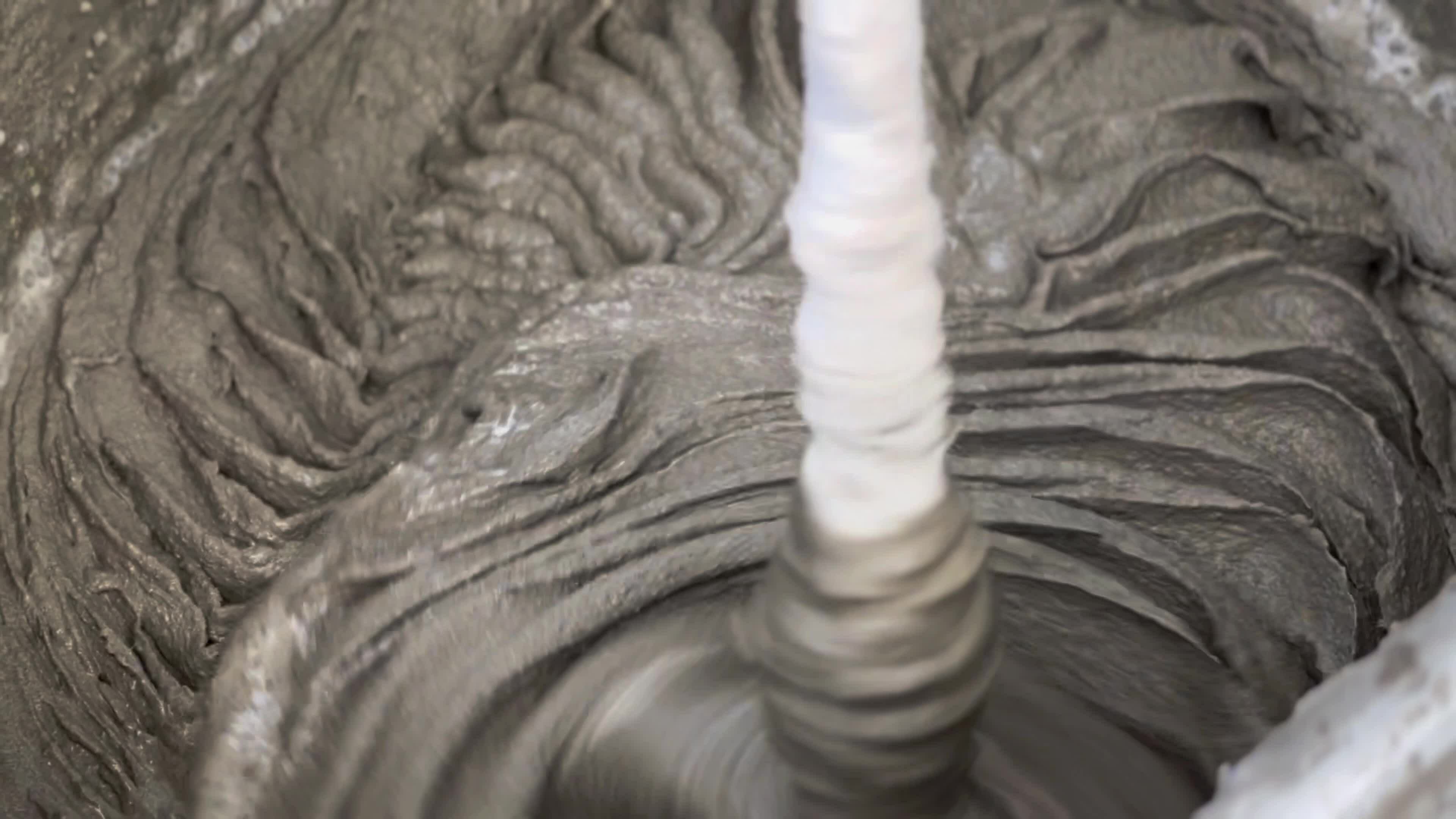 Mixing of dry building mixes with mixers. Wet mortar mixture for