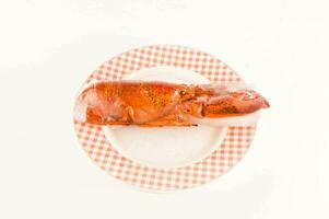 a lobster on a checkered plate photo