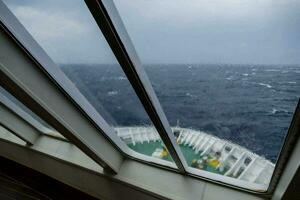 a view from the deck of a cruise ship looking out at the ocean photo