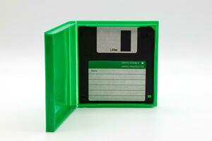 Floppy disk of 1.4 megabytes isolated on white background. Vintage storage for computer. photo