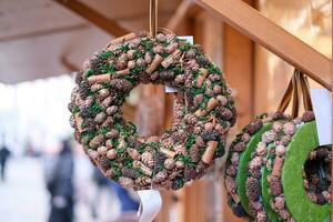 Handcrafted Christmas wreaths at a European Cristmas market photo