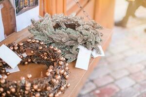 Handcrafted Christmas wreaths at a European Cristmas market photo