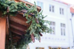 Close-up of Christmas decor adorning a shop facade at a European Christmas market. photo