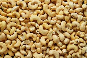 Roasted cashew nuts background. Top view of cashew nuts. photo