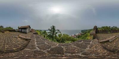 full hdri 360 panorama portuguese defensive abandoned military fortress with old guns on ocean in equirectangular spherical projection with zenith and nadir. VR AR content photo