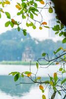 Hoan Kiem Lake - Ho Guom or Sword lake in the center of Hanoi in the fog in the morning. photo