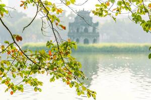 Hoan Kiem Lake - Ho Guom or Sword lake in the center of Hanoi in the fog in the morning. photo