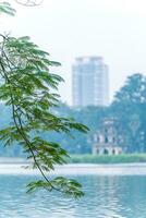 Hoan Kiem Lake - Ho Guom or Sword lake in the center of Hanoi in the fog in the morning. photo