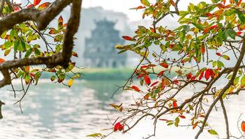 Hoan Kiem Lake - Ho Guom or Sword lake in the center of Hanoi in the fog in the morning. photo