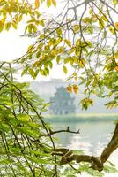 Hoan Kiem Lake - Ho Guom or Sword lake in the center of Hanoi in the fog in the morning. photo