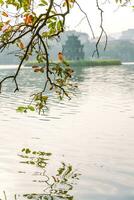 Hoan Kiem Lake - Ho Guom or Sword lake in the center of Hanoi in the fog in the morning. photo