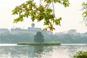 Hoan Kiem Lake - Ho Guom or Sword lake in the center of Hanoi in the fog in the morning. photo